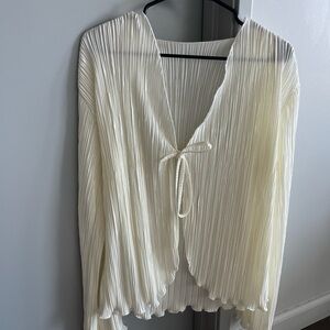 Cream tie-front blouse with pleated detail